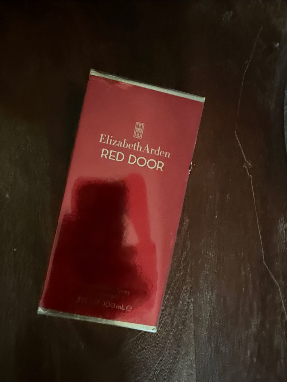 Elizabeth Arden Red Door Fragrance Packaging in Deep Red with Gold Accents